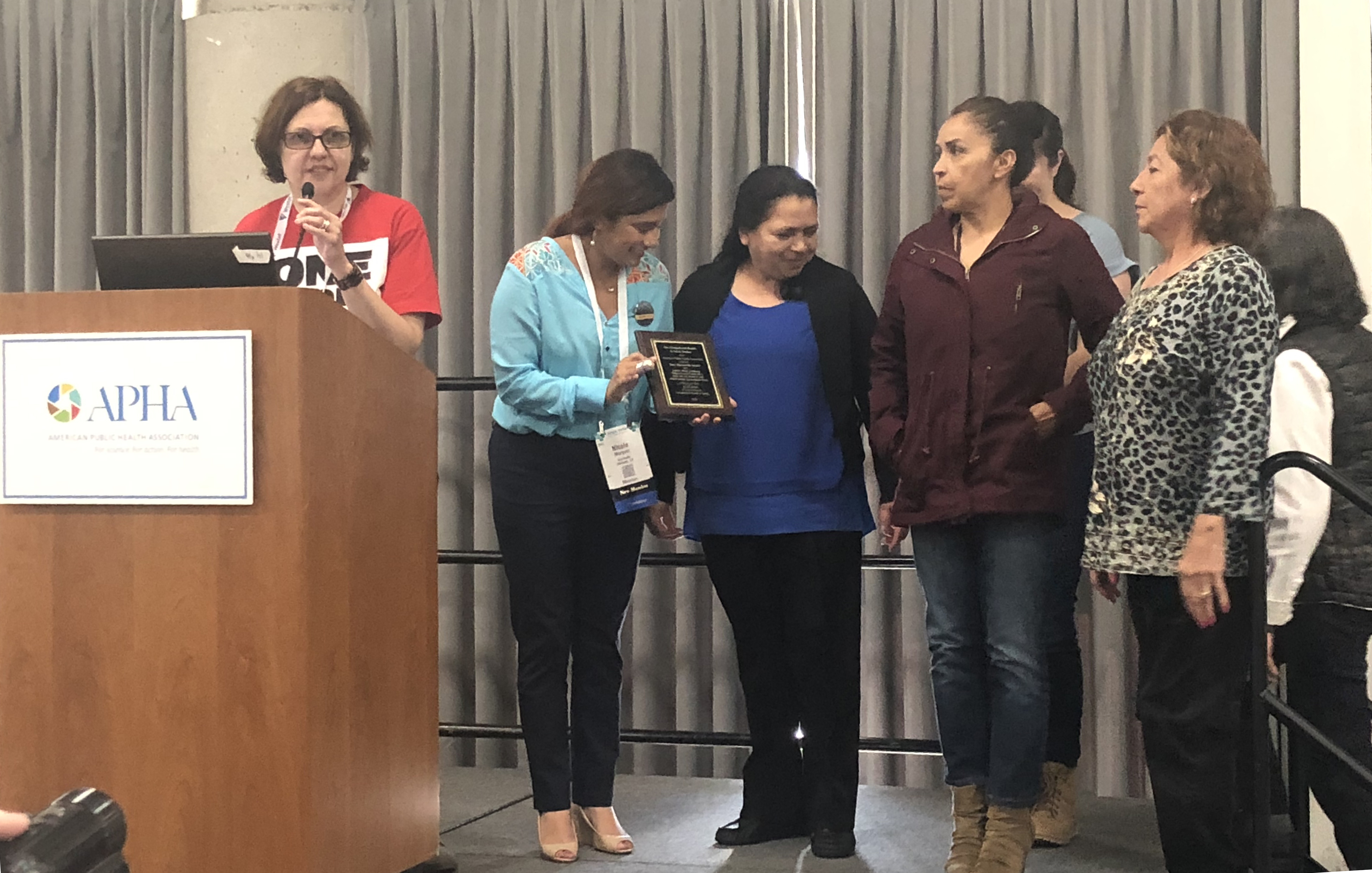 Pamela Vossenas and union members accepting award at APHA 2018 meeting