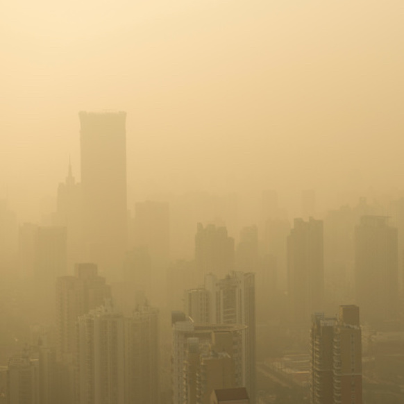 city shrouded in fog of air pollution