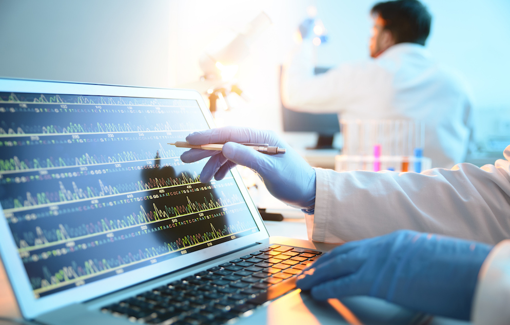 A scientist looking at a DNA sequence