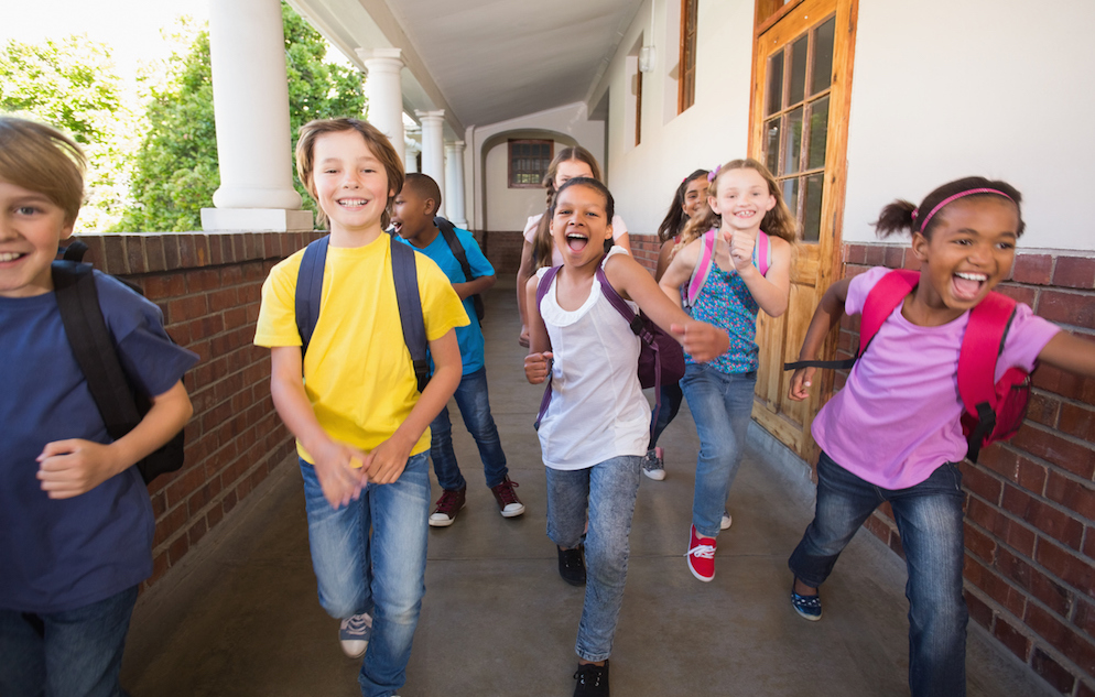 Students running down the hall at the elementary school