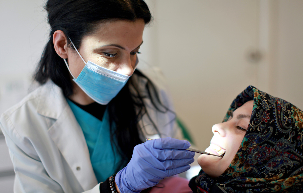 Dentist examining patient