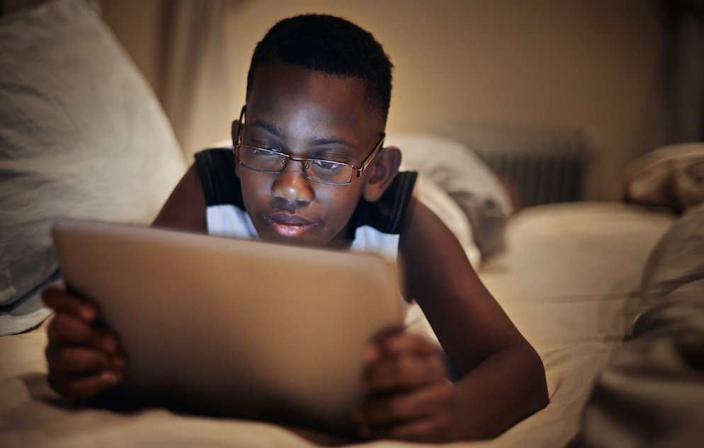 young boy using a tablet computer