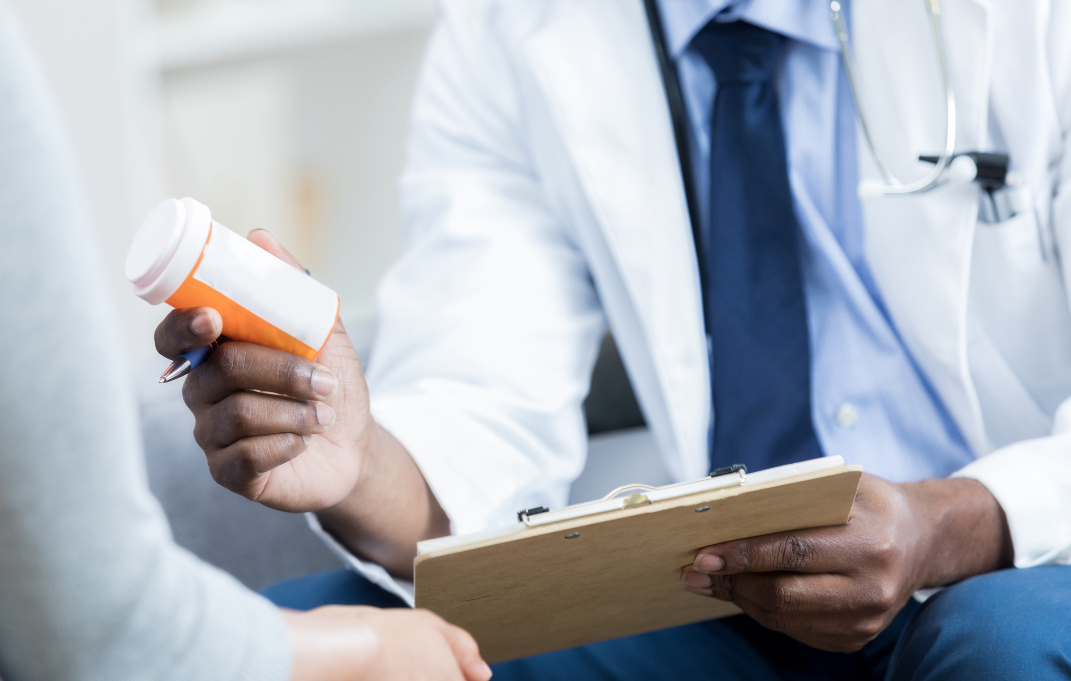 Doctor gives patient prescription medication