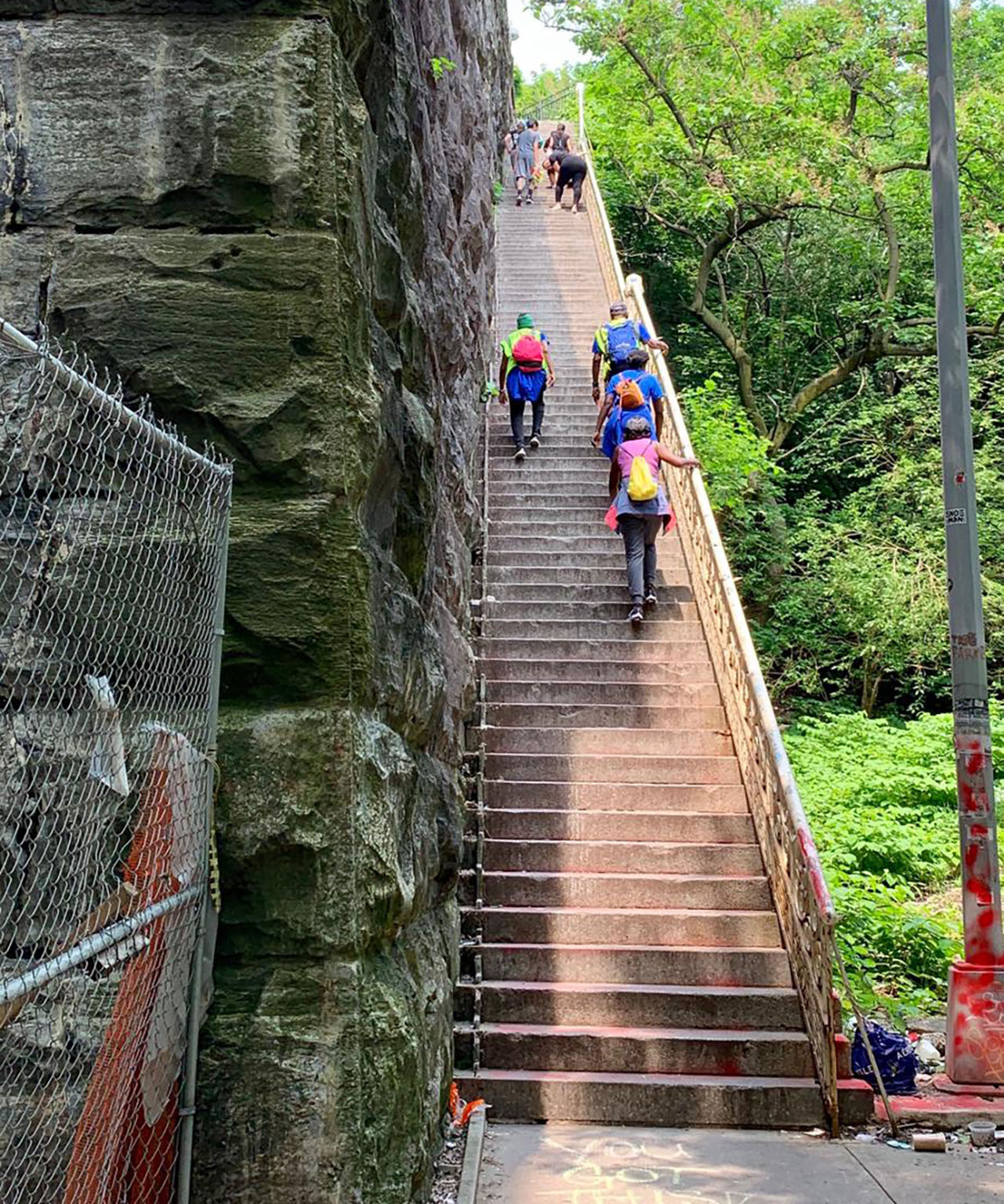 Hikers climbing stairs in NYC park