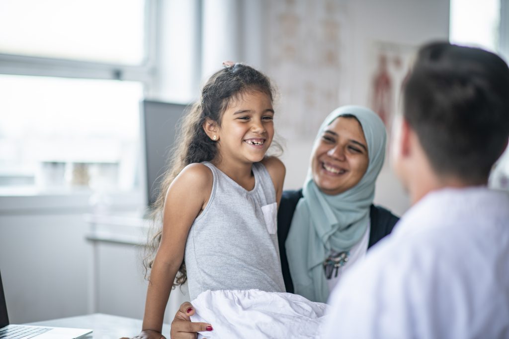 Muslim mother and daughter visiting the doctor