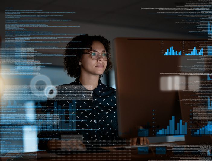 woman analyzing data code on computer screen
