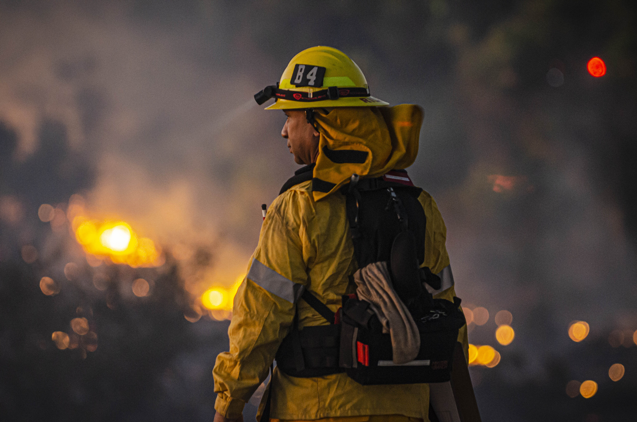 Firefighter battling wildfire