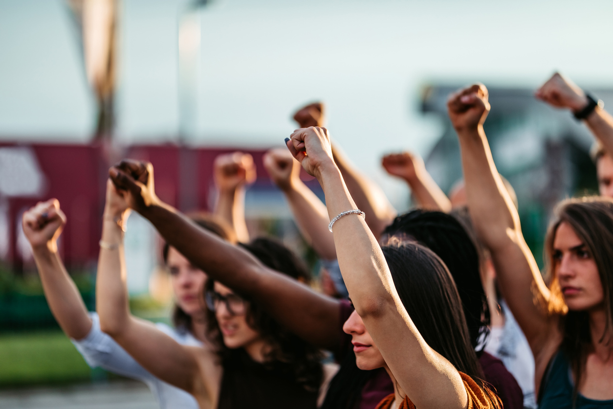 Women Protestors raising fists