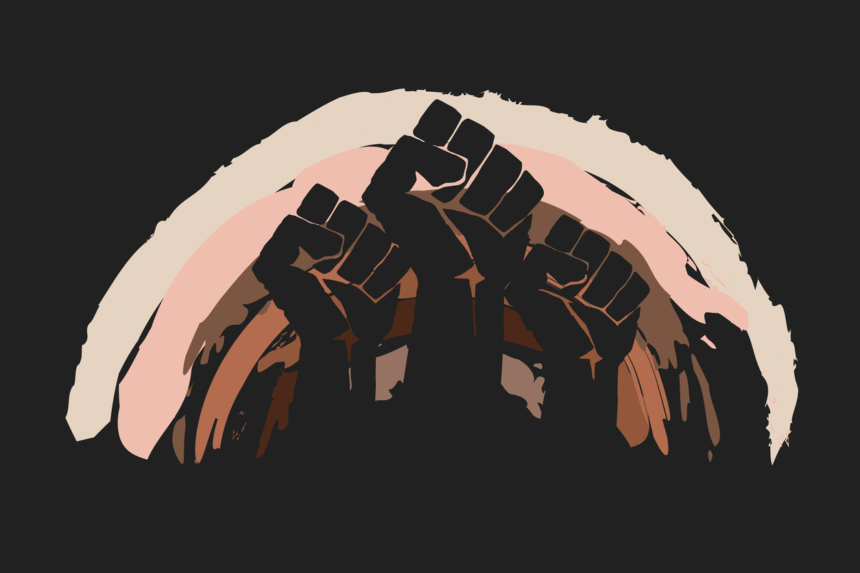 Fist protesting on background of rainbow in skin colors