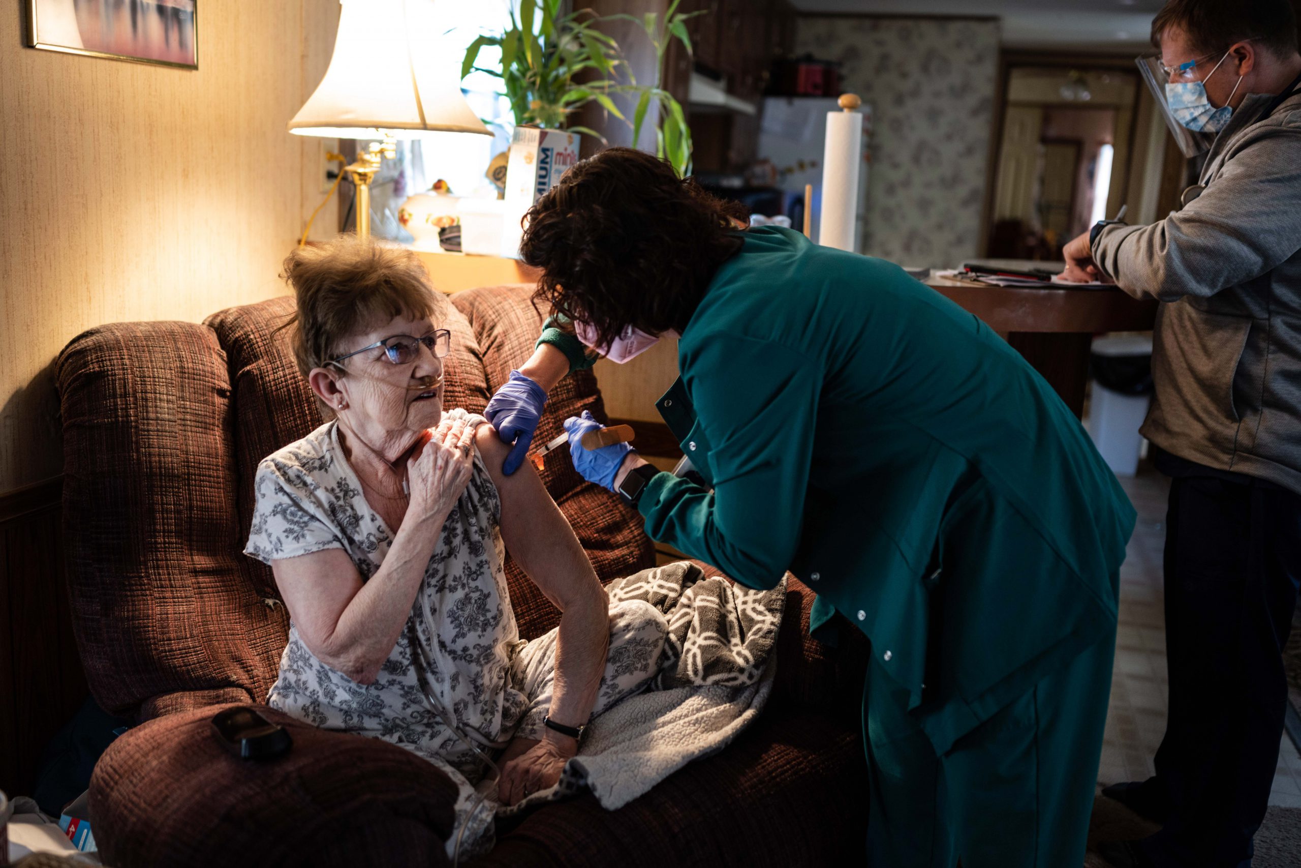 Chrissy Dean, LPN, gives Garnet Criswell her COVID-19 vaccination
