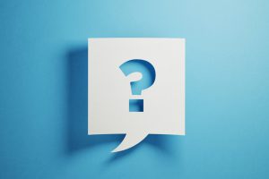 White chat bubble with question mark on blue background