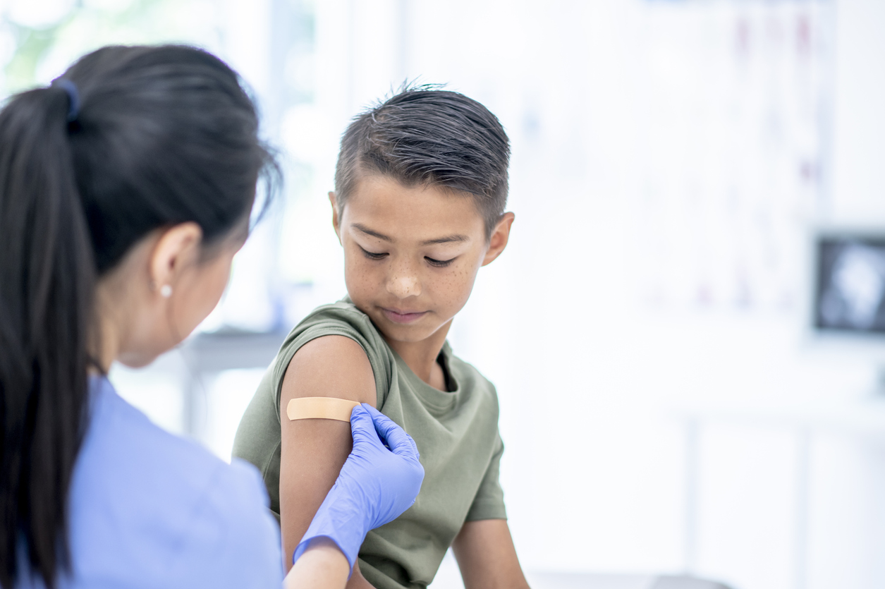 Young boy gets vaccine