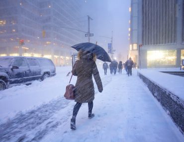 woman walking in snow storm