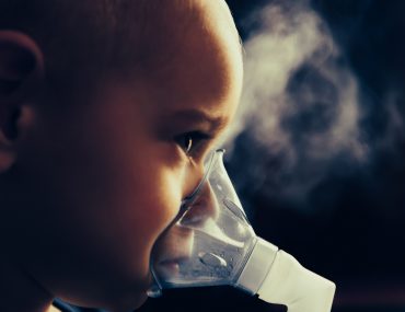 child using nebulizer
