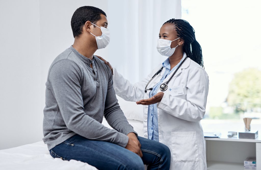 doctor discussing information with patient