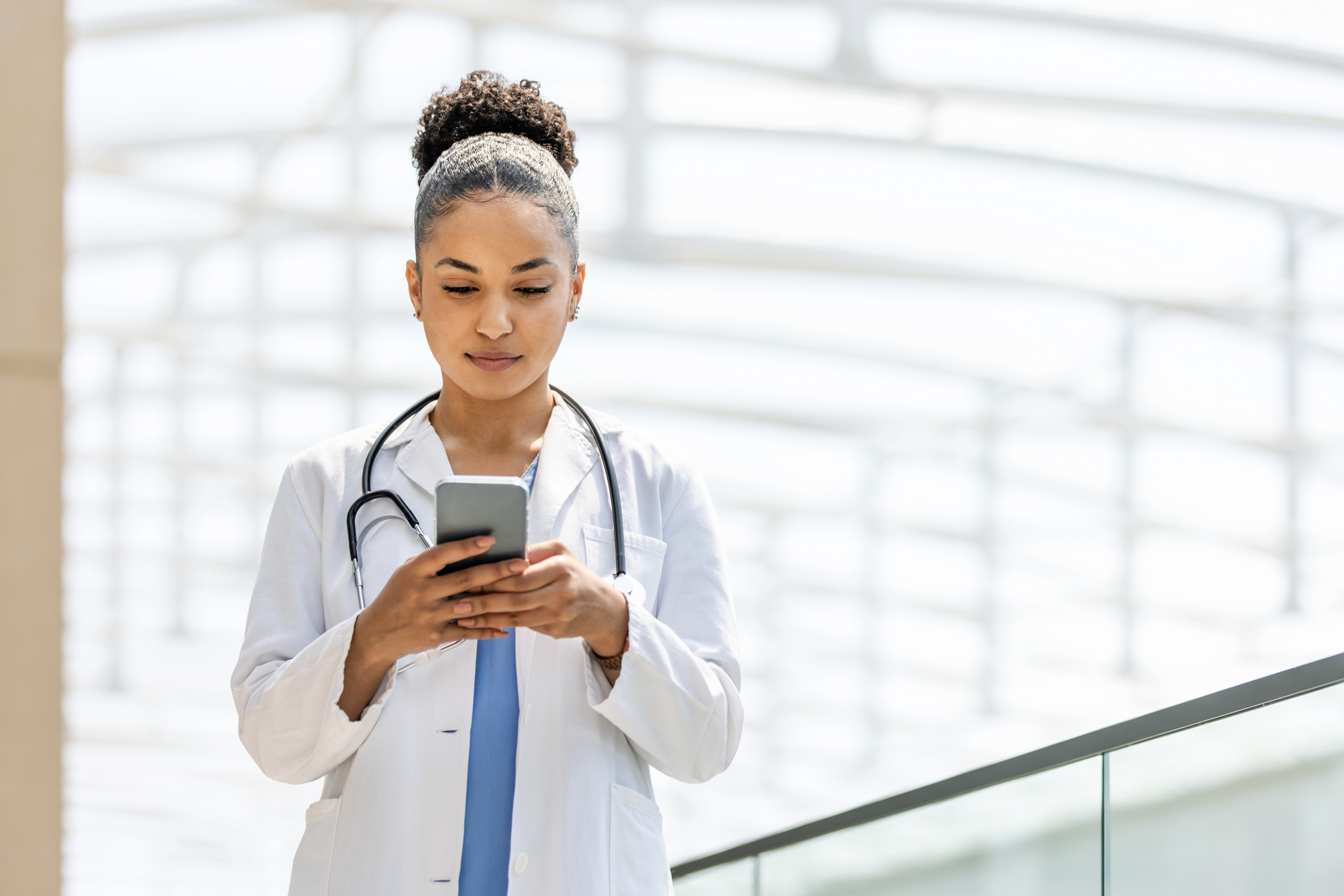 Young female doctor using a smartphone