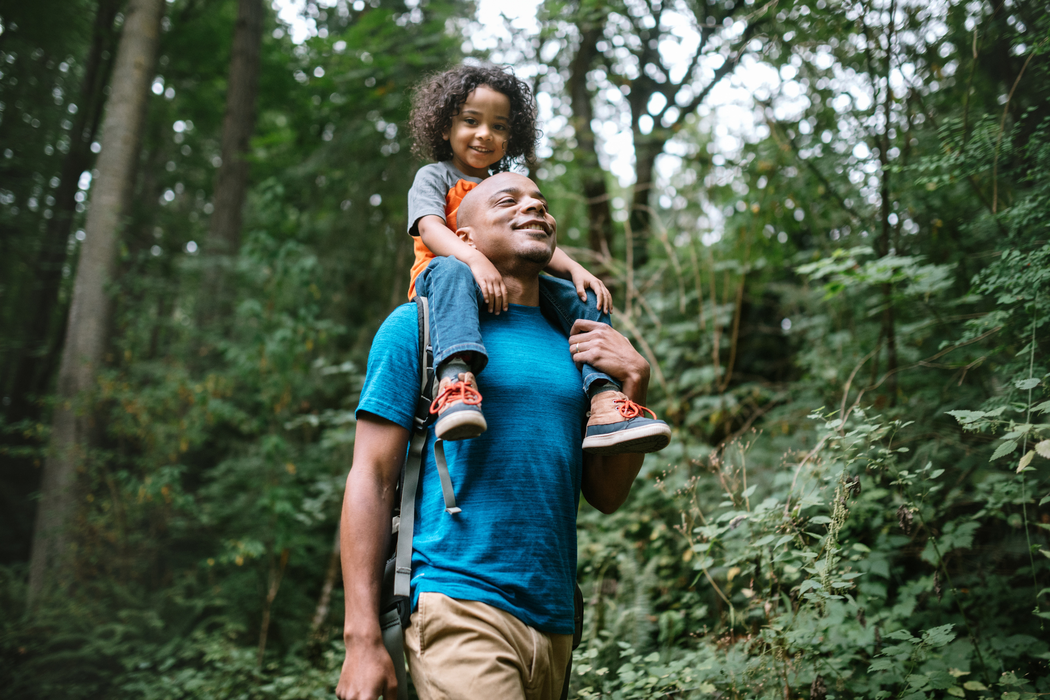 father and young son hiking