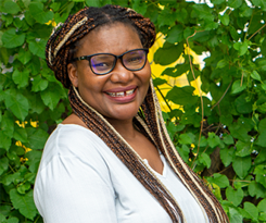 Photo of Faye Macheke, a Pan-African feminist, active in movements for women's rights, racial justice, migrant and labor rights, and environmental justice.