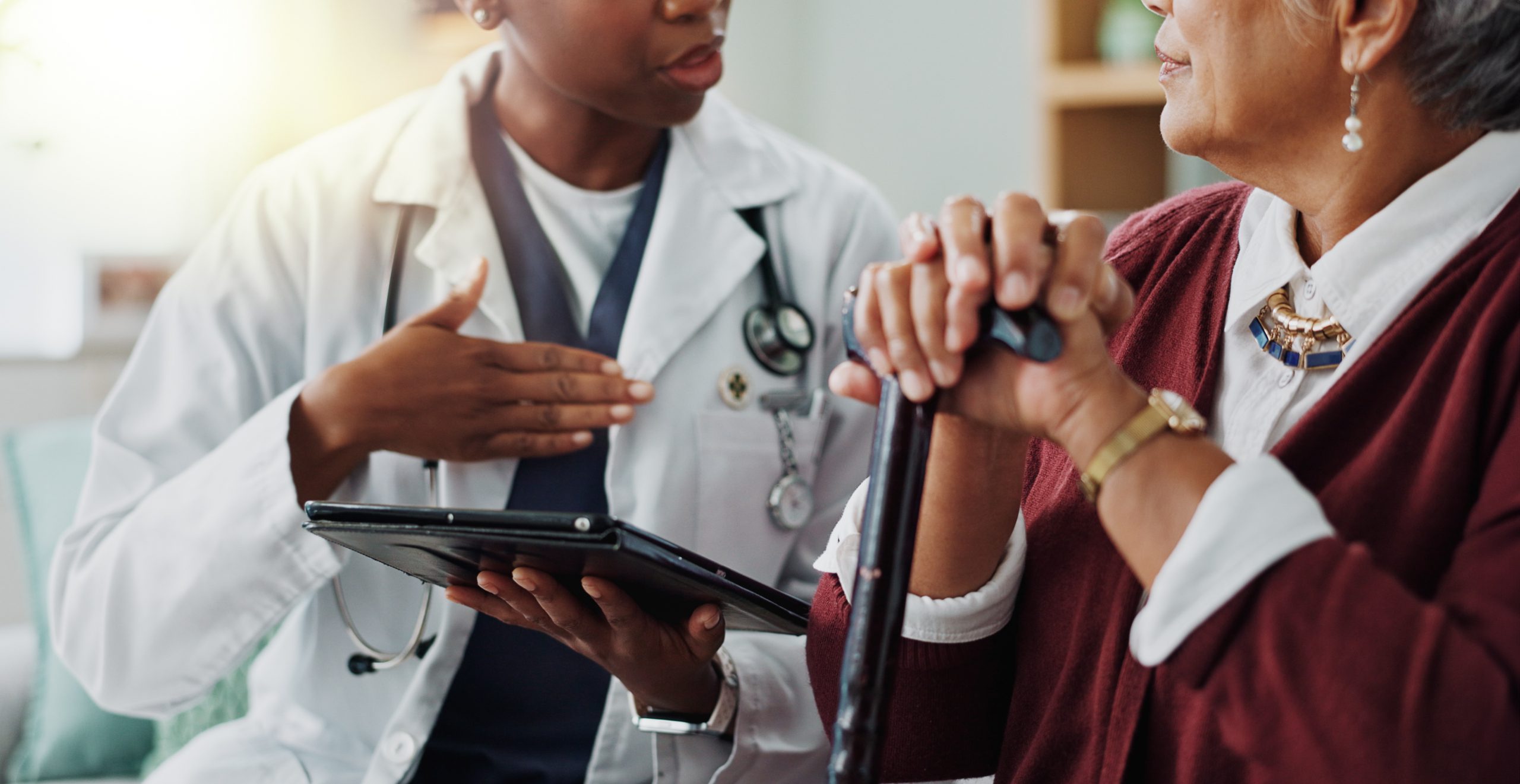 doctor speaking with older patient