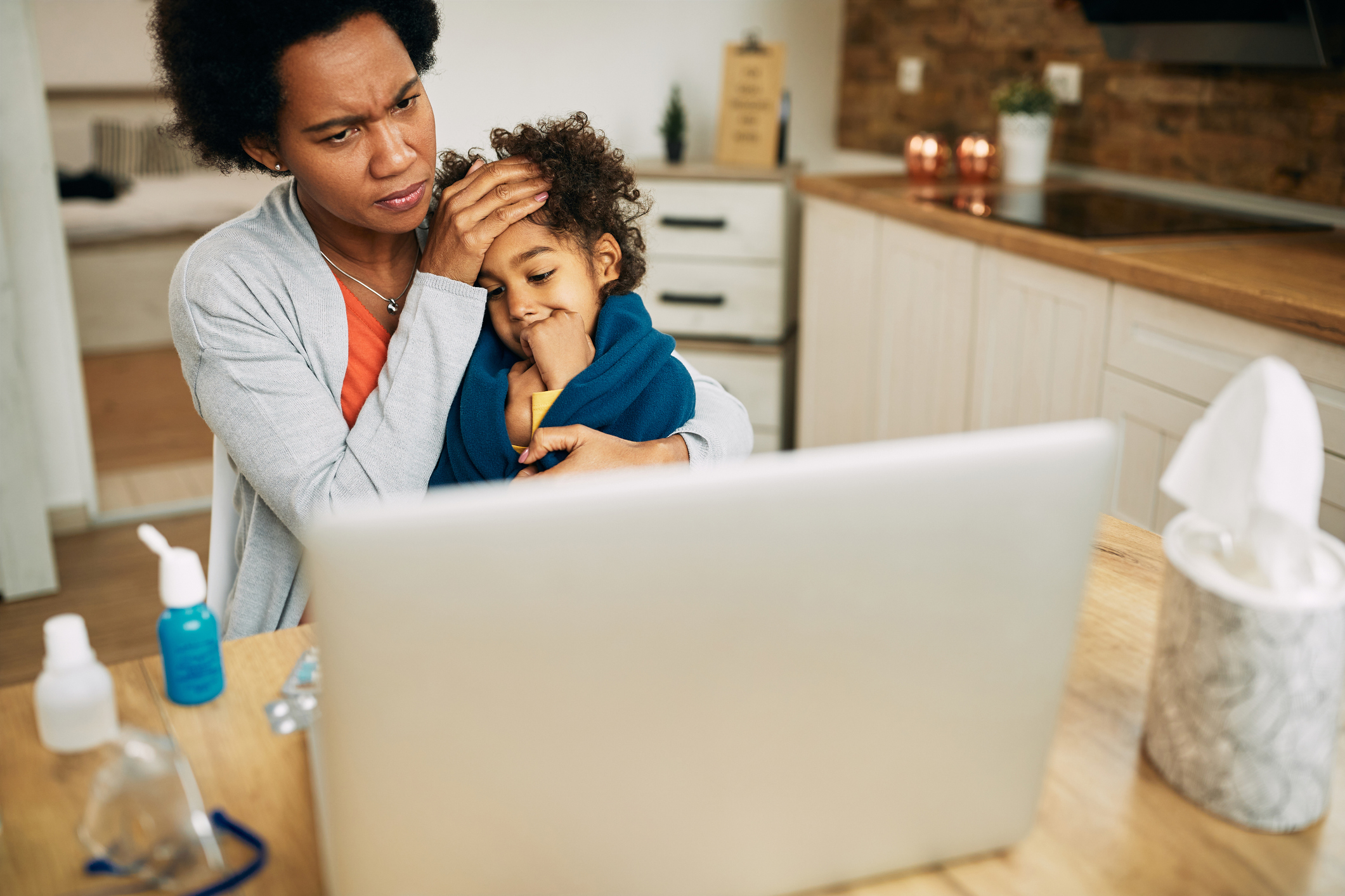 Mom with sick kid searching online