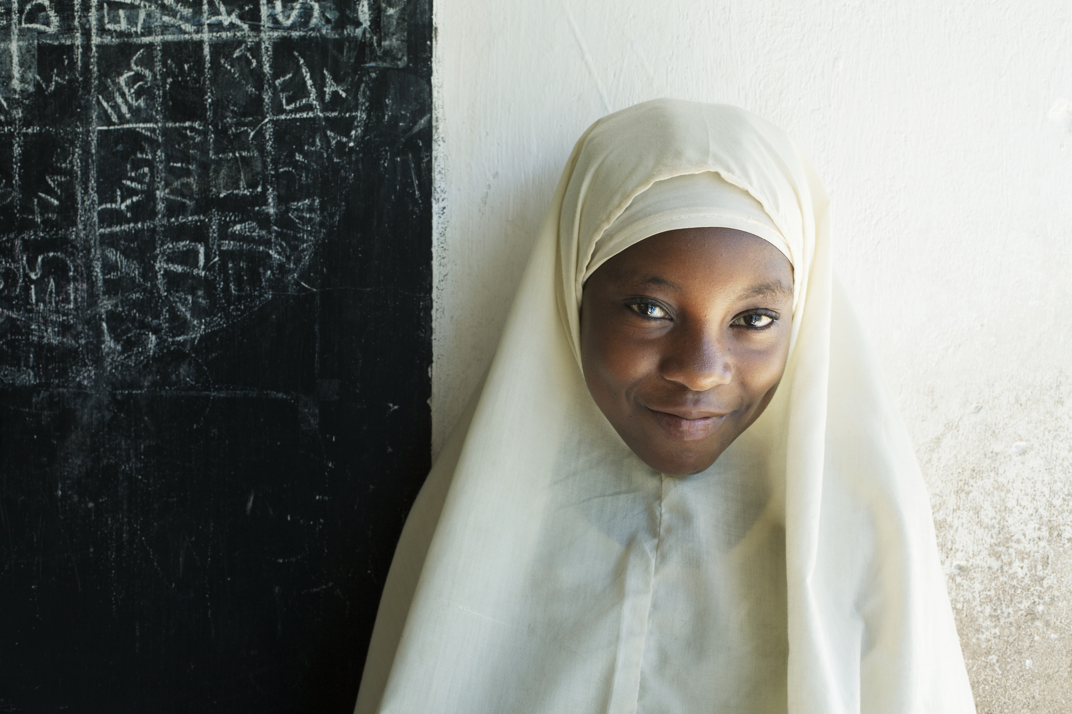 Girl in classroom in Tanzania