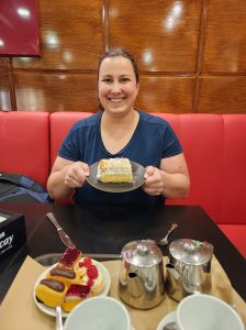 Elizabeth Whittemore poses with slice of costrada, a local Alcalá dessert.