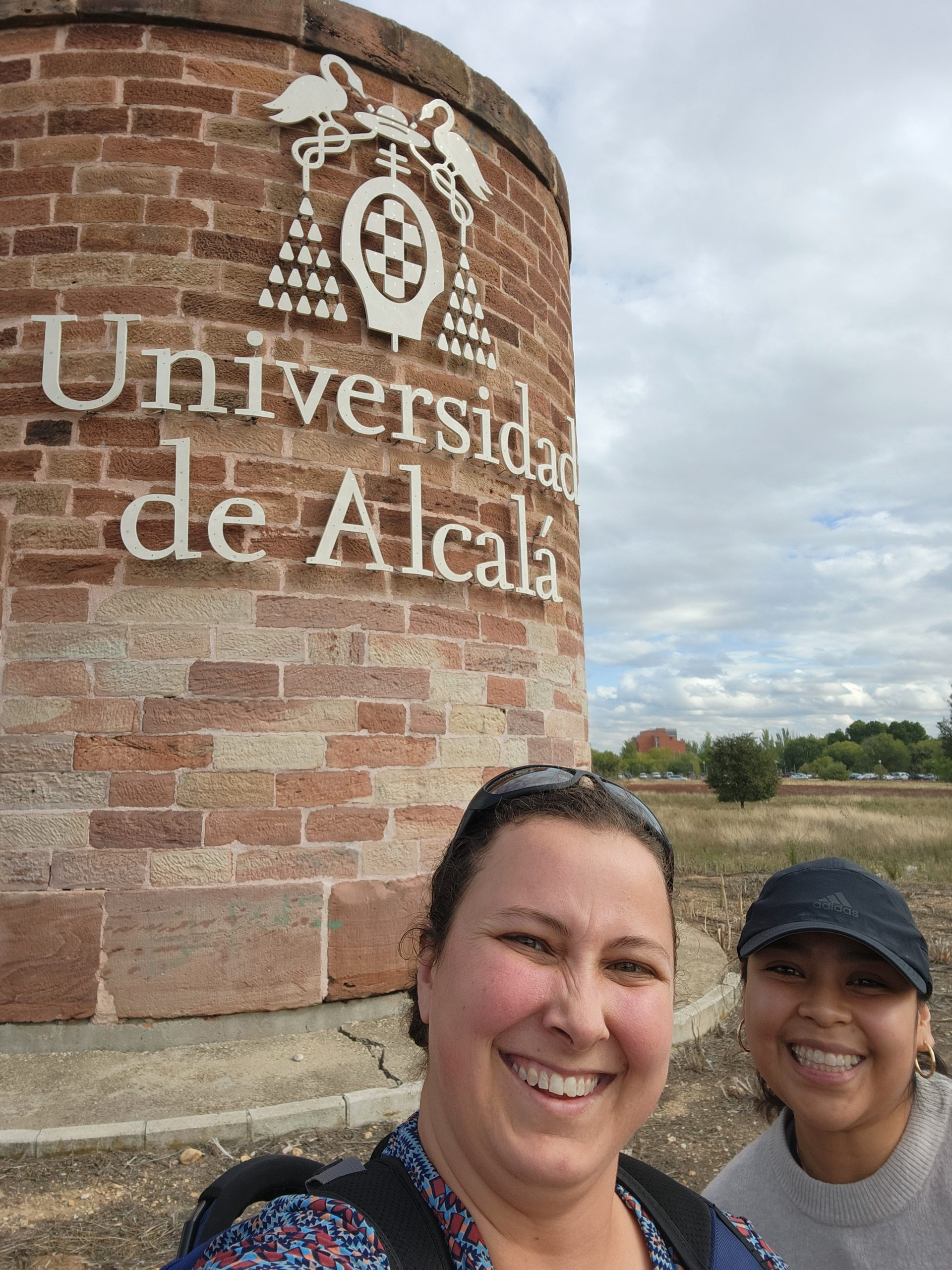 Whittemore and Hernandez pose in front of the University of Alcalá.