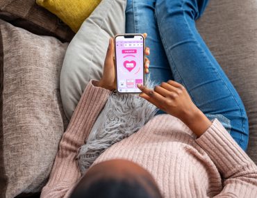 woman uses period tracker app