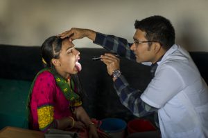 Nepal’s health insurance program: challenges and early impacts