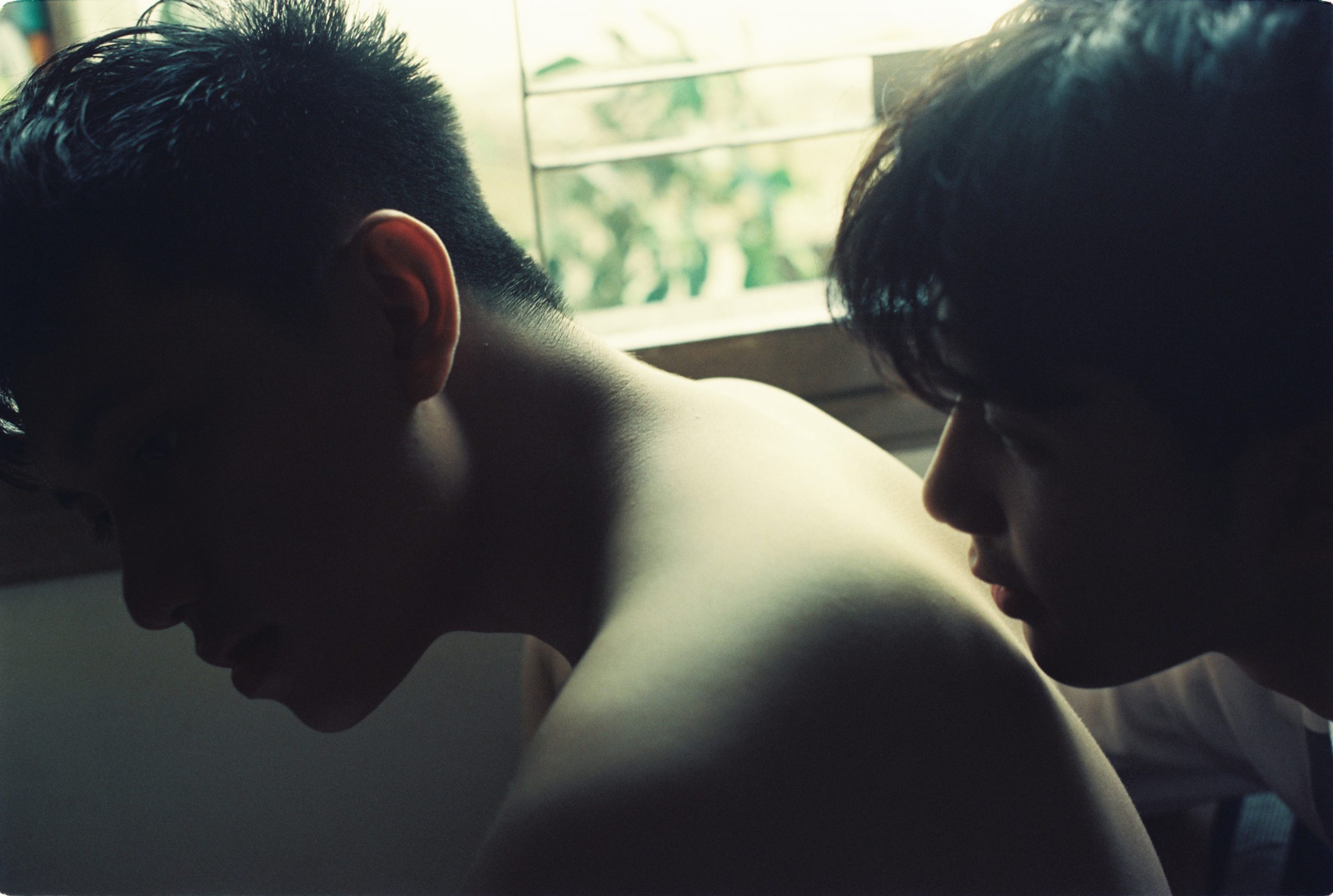 two young men shirtless