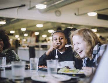 Children laughing in cafeteria