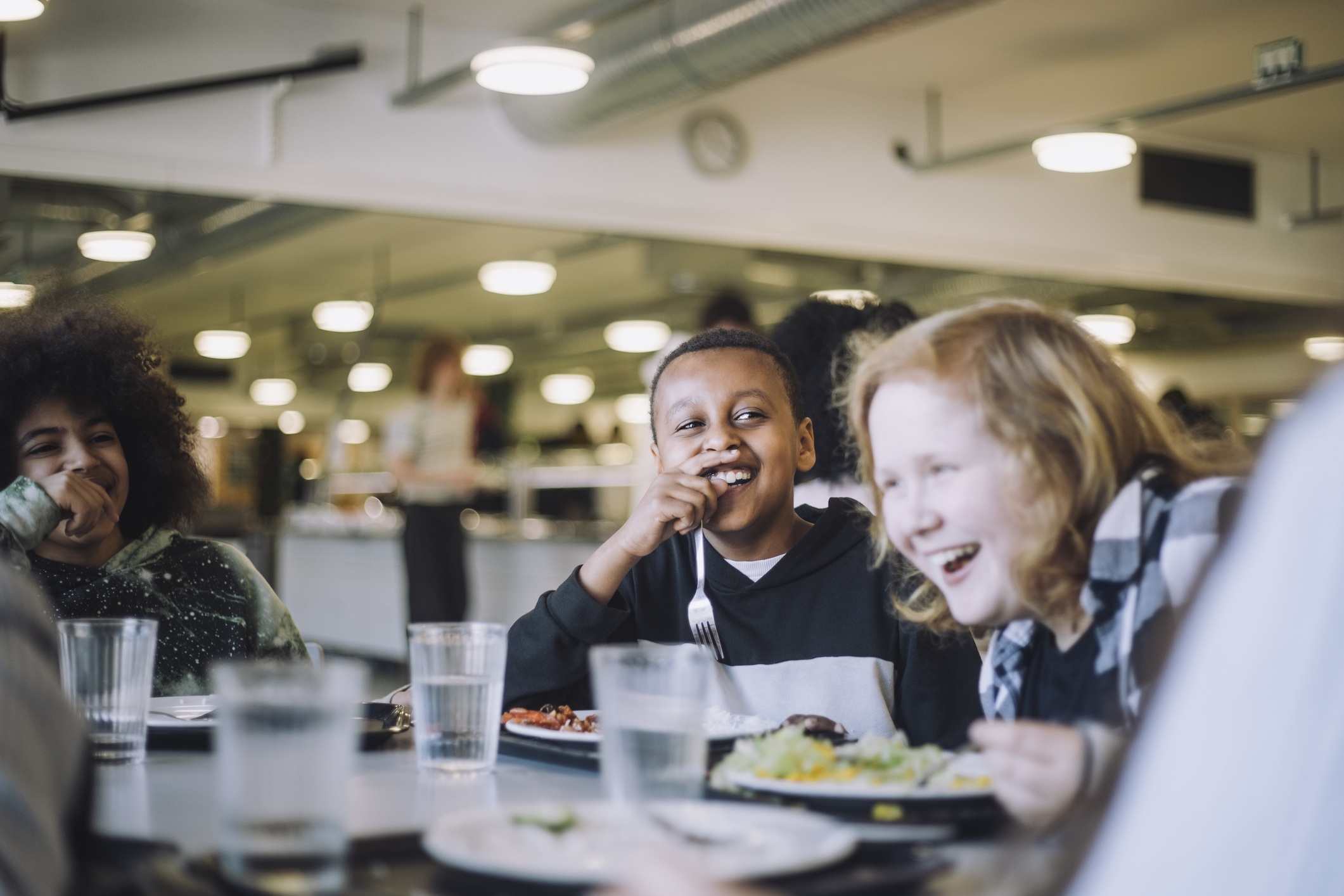 Children laughing in cafeteria