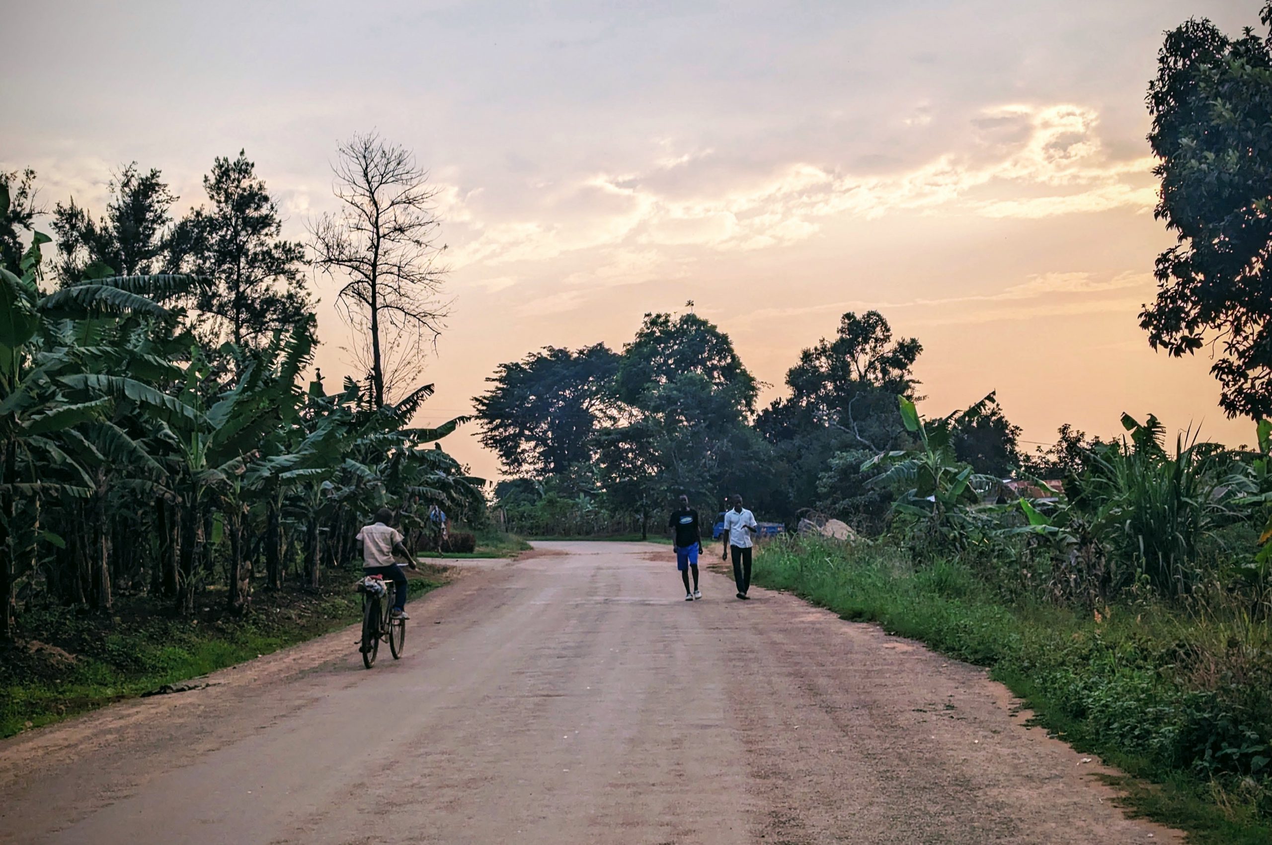 Young people walk along road in rural Uganda