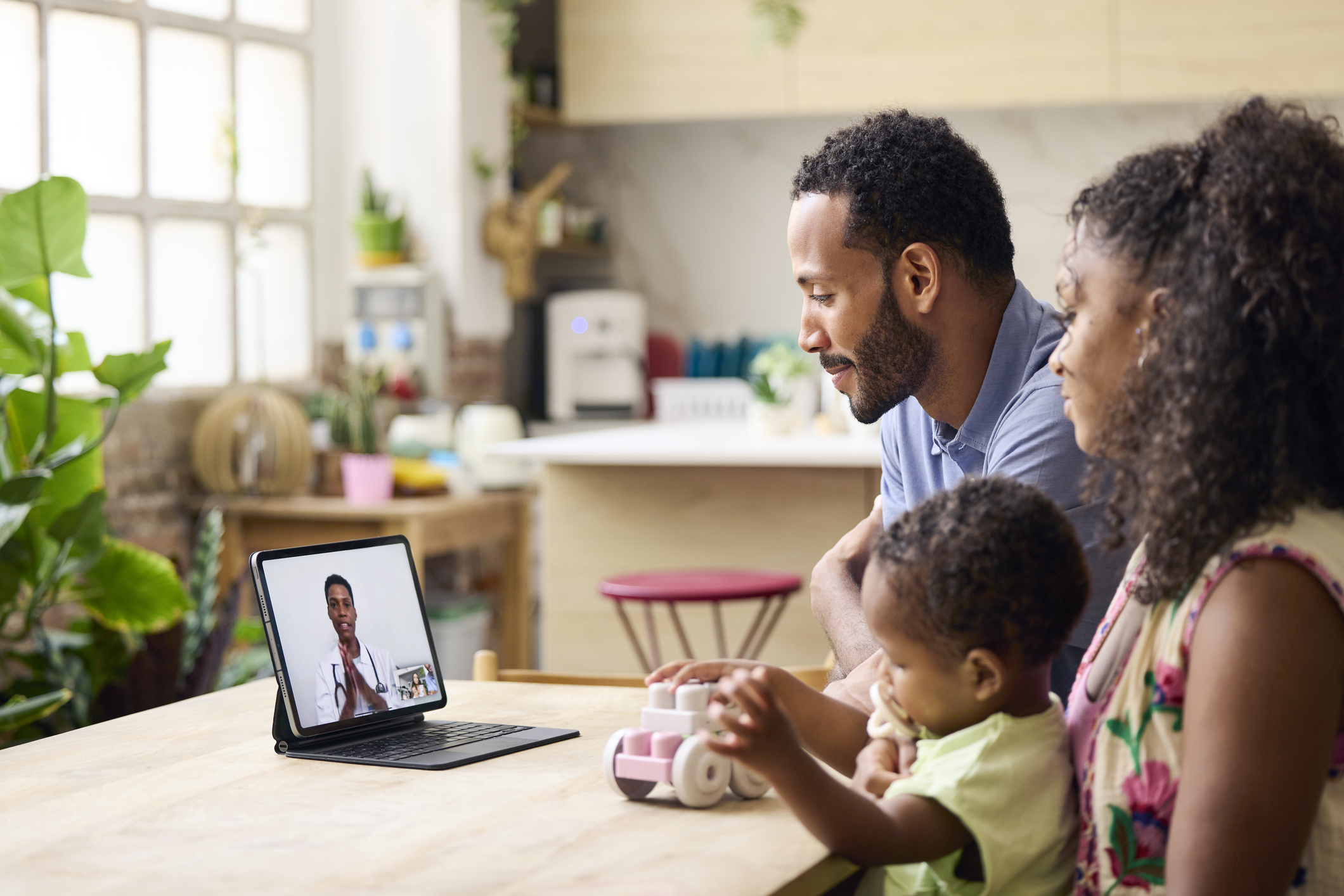 Family taking online consultation at home