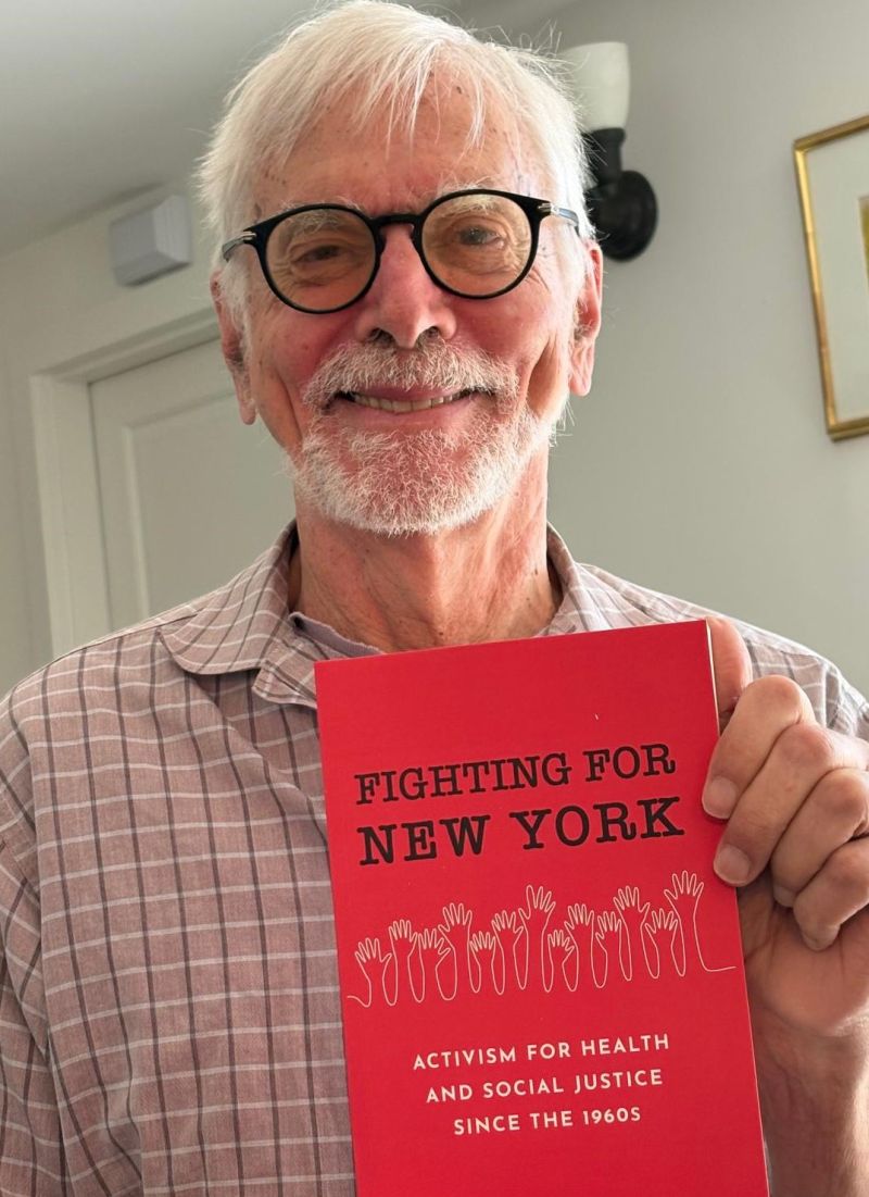 Distinguished Professor Emeritus Nick Freudenberg with book