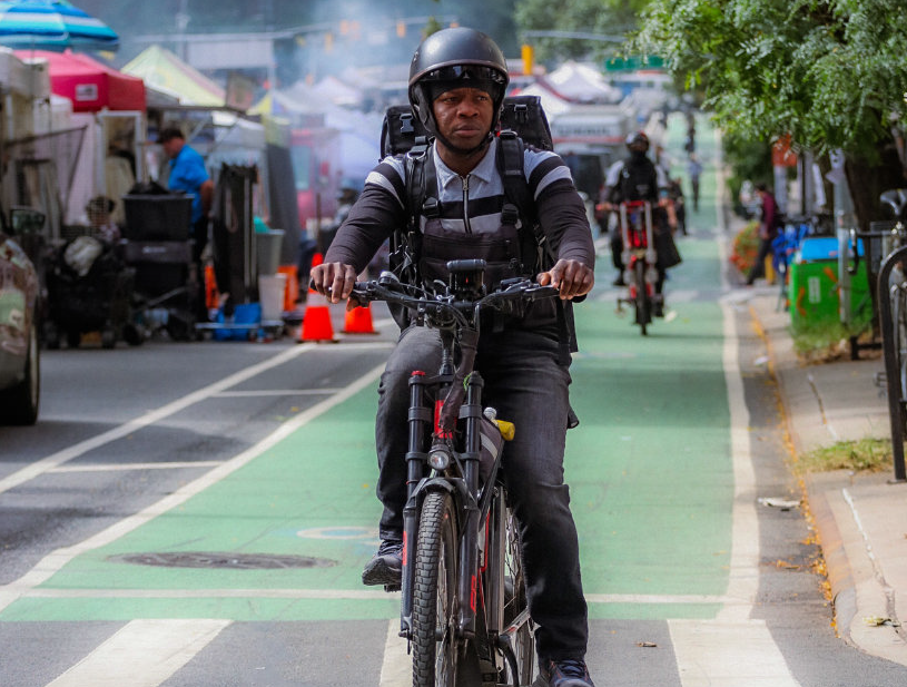delivery worker on bicycle