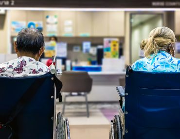 patients in wheelchairs wait to be seen at doctor's office