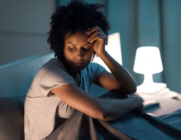 Young stressed woman suffering from insomnia
